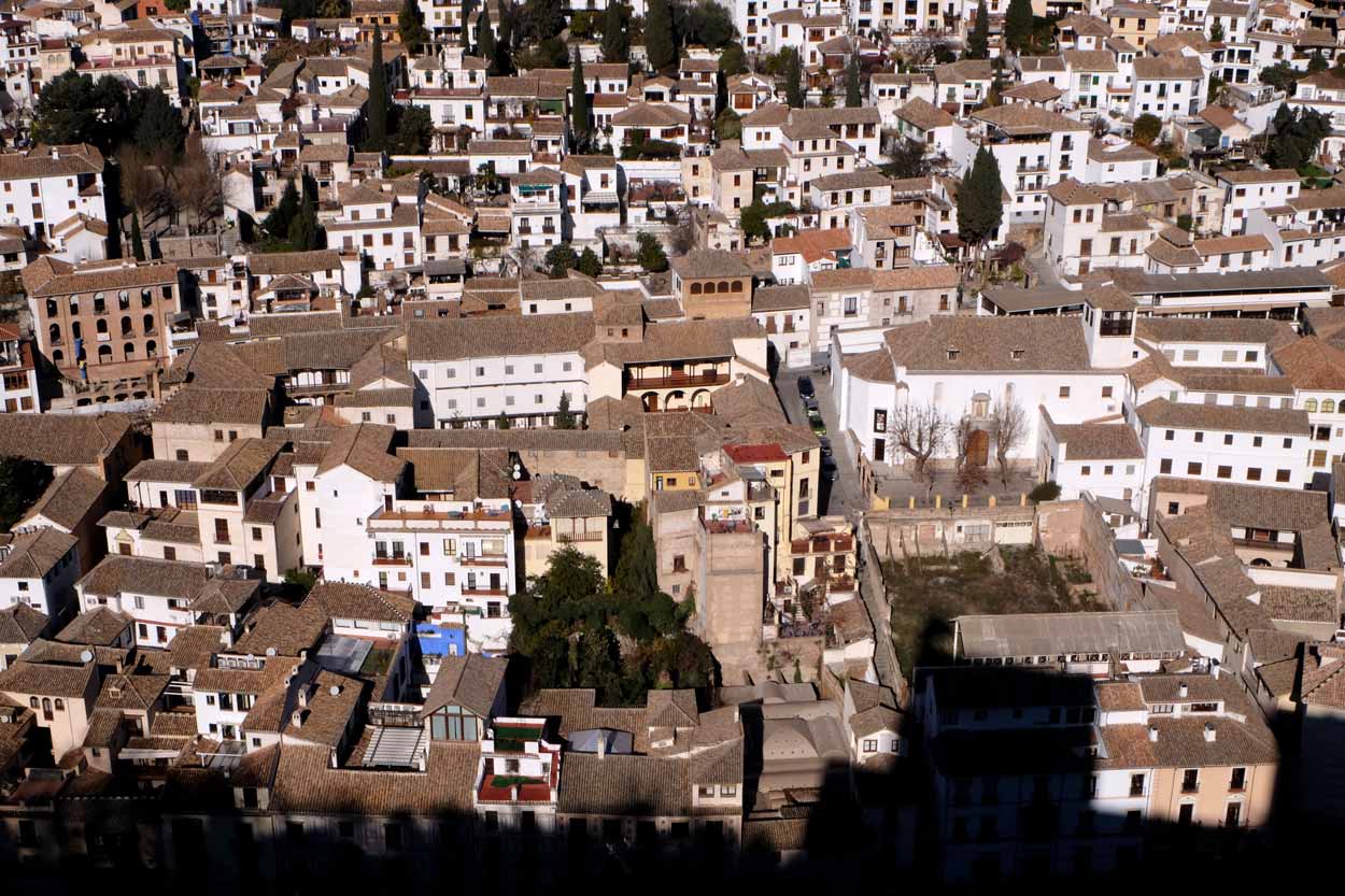 The Albaicín view from the Alcazaba with a bit of Alhambra's shadow.